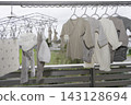 Baby clothes drying on the balcony 143128694