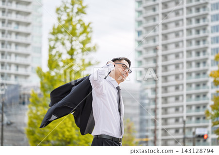 A businessman with a jacket A businessman with a jacket 143128794