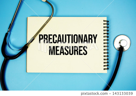Precautionary Measures text with stethoscope and magnifying glass on blue background Precautionary Measures text with stethoscope and magnifying glass on blue background 143133039