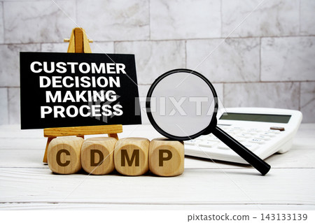 CDMP Customer Decision Making Process text with calculator magnifying glass and on wooden background CDMP Customer Decision Making Process text with calculator magnifying glass and on wooden background 143133139