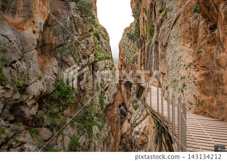 ooden boardwalk clinging to sheer canyon walls at Caminito del Rey, Spain 143134212