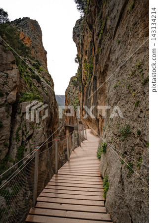 ooden boardwalk clinging to sheer canyon walls at Caminito del Rey, Spain ooden boardwalk clinging to sheer canyon walls at Caminito del Rey, Spain 143134214