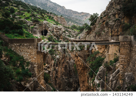Steel footbridge spanning the deep Gaitanejo gorge at Caminito del Rey, Spain Steel footbridge spanning the deep Gaitanejo gorge at Caminito del Rey, Spain 143134249