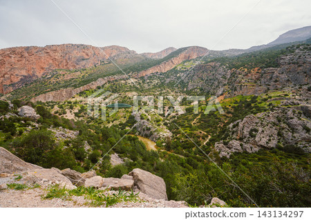 Green railway bridge crossing a lush canyon valley near Caminito del Rey, Spain 143134297