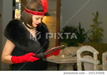 Retro event hostess, celebrate presenter in black red vintage style Retro event hostess, celebrate presenter in black red vintage style 143135008