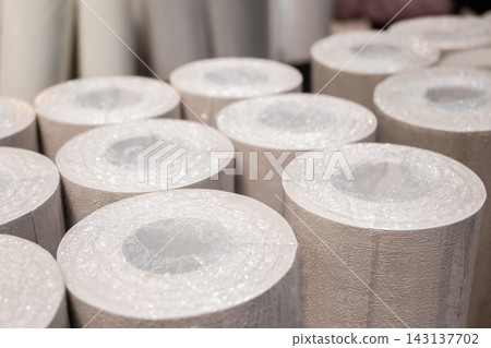 Light rolls of paper wallpaper. Shop with decorative materials for room renovation. Light rolls of paper wallpaper. Shop with decorative materials for room renovation. 143137702