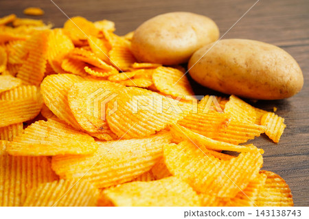 Potato chips , delicious BBQ seasoning spicy for crips, thin slice deep fried snack fast food. Potato chips , delicious BBQ seasoning spicy for crips, thin slice deep fried snack fast food. 143138743
