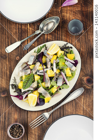 Healthy herring salad with potatoes and fresh herbs Healthy herring salad with potatoes and fresh herbs 143140016