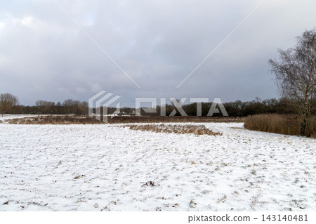 Winter landscape with snow covered field Winter landscape with snow covered field 143140481