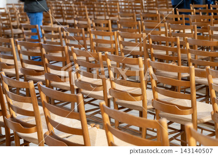 Empty seating arrangement inside hall awaiting visitors or audience. Empty seating arrangement inside hall awaiting visitors or audience. 143140507