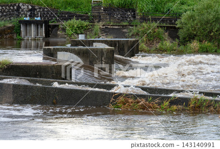 Rivers swollen by rain Rivers swollen by rain 143140991