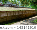 A long wooden fence leading into the grounds of Izumo Taisha Shrine 143141910