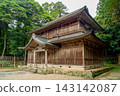 Wooden shrine buildings within the grounds of Izumo Taisha Shrine, surrounded by greenery. 143142087