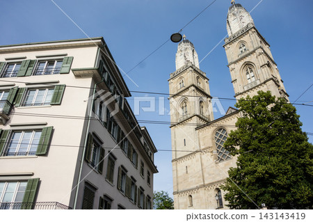 A church with large twin towers bathed in bright sunlight - the cityscape of Zurich, Switzerland A church with large twin towers bathed in bright sunlight - the cityscape of Zurich, Switzerland 143143419
