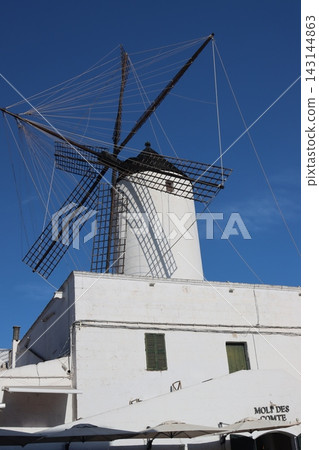 White traditional spanish windmill architecture under blue sky White traditional spanish windmill architecture under blue sky 143144863