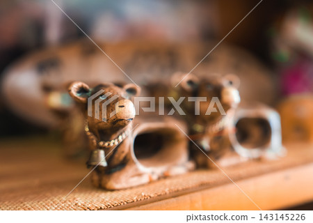 Ceramic cow figurines displayed on a shelf in Namibia Ceramic cow figurines displayed on a shelf in Namibia 143145226
