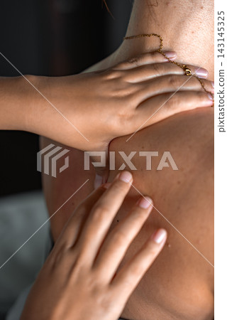 Therapist massaging shoulder and upper back at a Maldives resort Therapist massaging shoulder and upper back at a Maldives resort 143145325