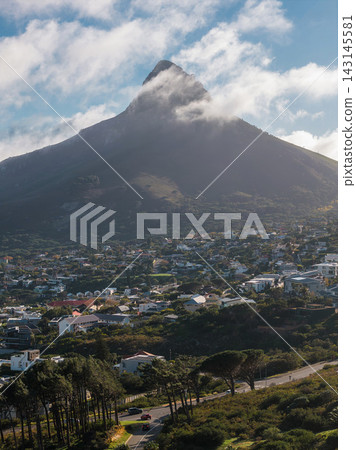 Aerial view of Lion's Head above Cape Town neighborhoods at dusk Aerial view of Lion's Head above Cape Town neighborhoods at dusk 143145581