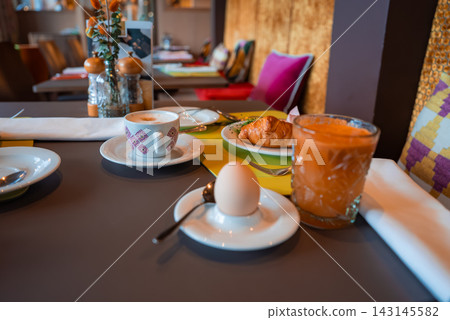 Breakfast table at luxury winter hotel dining room in Oberlech 143145582