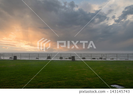 Dramatic Storm Clouds over the Sea Point Promenade in Cape Town Dramatic Storm Clouds over the Sea Point Promenade in Cape Town 143145743