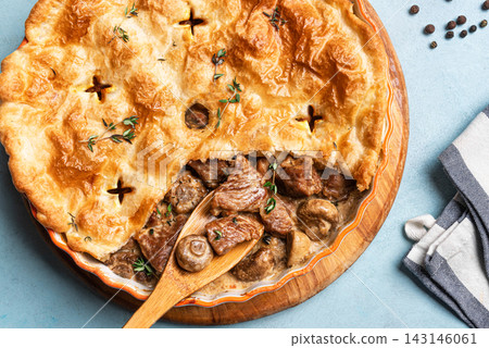 Beef Meat and Mushroom Pie on blue background Beef Meat and Mushroom Pie on blue background 143146061
