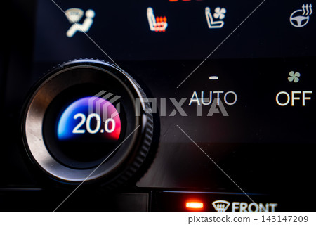 Close up cabin view shows Lexus RX 450h plus climate panel at 20.0 Celsius, a blue to red gradient, AUTO and OFF touch controls, and seat heat and ventilation icons. Close up cabin view shows Lexus RX 450h plus climate panel at 20.0 Celsius, a blue to red gradient, AUTO and OFF touch controls, and seat heat and ventilation icons. 143147209