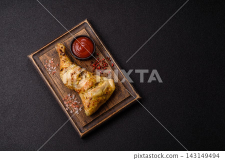 Grilled chicken quarter seasoned with mustard, spices, and salt. Grilled chicken leg Grilled chicken quarter seasoned with mustard, spices, and salt. Grilled chicken leg 143149494