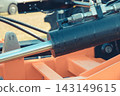 Black pistons or actuators in red pneumatic or hydraulic machine. Technology 143149615