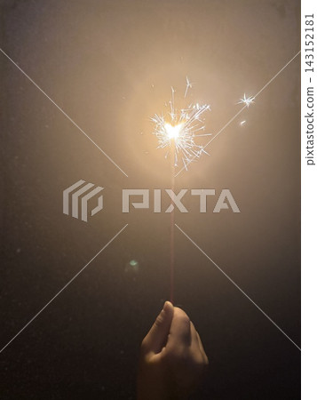 Handheld fireworks shining in the darkness and summer night 2 Handheld fireworks shining in the darkness and summer night 2 143152181