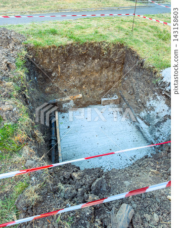 Construction work at a site showing a dugout area with a concrete base and safety barriers in place Construction work at a site showing a dugout area with a concrete base and safety barriers in place 143158603