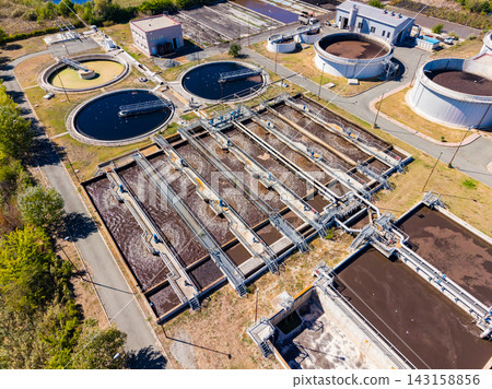 Water treatment facility processing wastewater at a large scale during daylight 143158856
