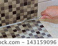 DIY Bathroom Tile Grout Removal and Repair 143159096
