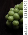 Shine Muscat grapes on a wooden table 143159702