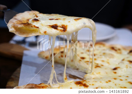 Crispy thin crust gorgonzola cheese pizza served with sweet honey Crispy thin crust gorgonzola cheese pizza served with sweet honey 143161892