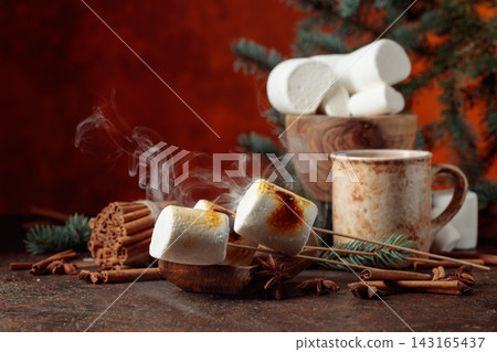 Toasted marshmallows on an old brown table. Toasted marshmallows on an old brown table. 143165437