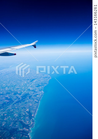 The Dover Strait and the French plains stretching along the coastline, viewed from the air while on an airplane. The Dover Strait and the French plains stretching along the coastline, viewed from the air while on an airplane. 143166261
