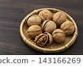 Walnuts in their shells 143166269
