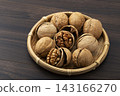 Walnuts in their shells 143166270