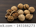 Walnuts in their shells 143166273