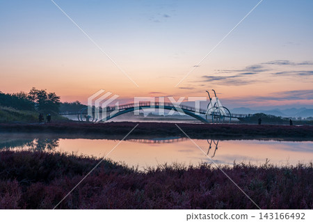 Sunrise Dawn over Misaeng Bridge with Water Reflection in Siheung Wetland, South Korea Sunrise Dawn over Misaeng Bridge with Water Reflection in Siheung Wetland, South Korea 143166492