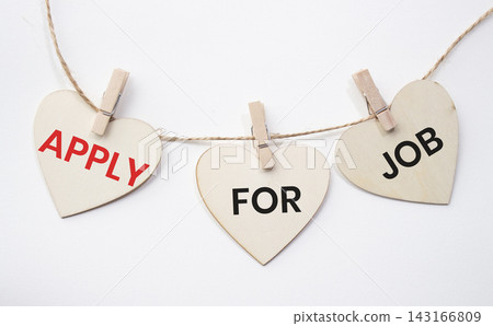 Apply For Job text on wooden heart tags hanging on rope with clothespins over white background. Employment opportunity and job application concept with copy space. Apply For Job text on wooden heart tags hanging on rope with clothespins over white background. Employment opportunity and job application concept with copy space. 143166809