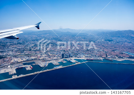 From an airplane, I saw the cityscape of Nice on the French Riviera, the mountains, and the Mediterranean Sea from the air. From an airplane, I saw the cityscape of Nice on the French Riviera, the mountains, and the Mediterranean Sea from the air. 143167705