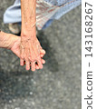Holding hands with an elderly person (vertical) 143168267