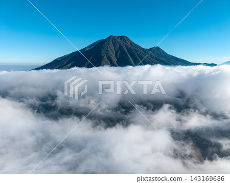 Aerial View of Mount Kawi Rising Above Tropical Clouds Aerial View of Mount Kawi Rising Above Tropical Clouds 143169686