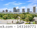 A view of the tower apartment buildings in Shinonome, Tokyo, across Tatsumi no Mori Seaside Park. 143169771
