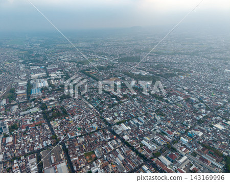 Hazy sky looms over dense urban sprawl Hazy sky looms over dense urban sprawl 143169996