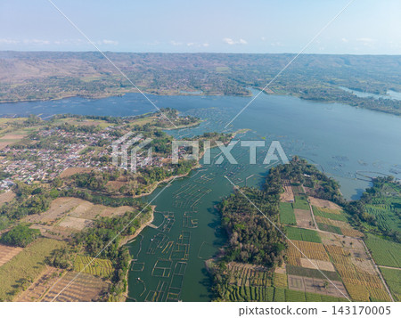 Aerial View of Lush Landscape with Water and Agricultural Fields Aerial View of Lush Landscape with Water and Agricultural Fields 143170005
