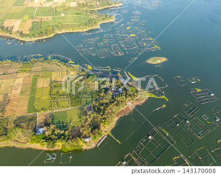 Aerial view of a tranquil lake with farming ponds Aerial view of a tranquil lake with farming ponds 143170008