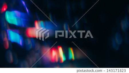 Blur circles. Rainbow light. Defocused purple blue pink colorful optical neon gleam reflection on abstract bokeh bright dark black background. Blur circles. Rainbow light. Defocused purple blue pink colorful optical neon gleam reflection on abstract bokeh bright dark black background. 143171823