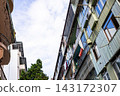 cloudy sky between apartment buildings in Batumi 143172307